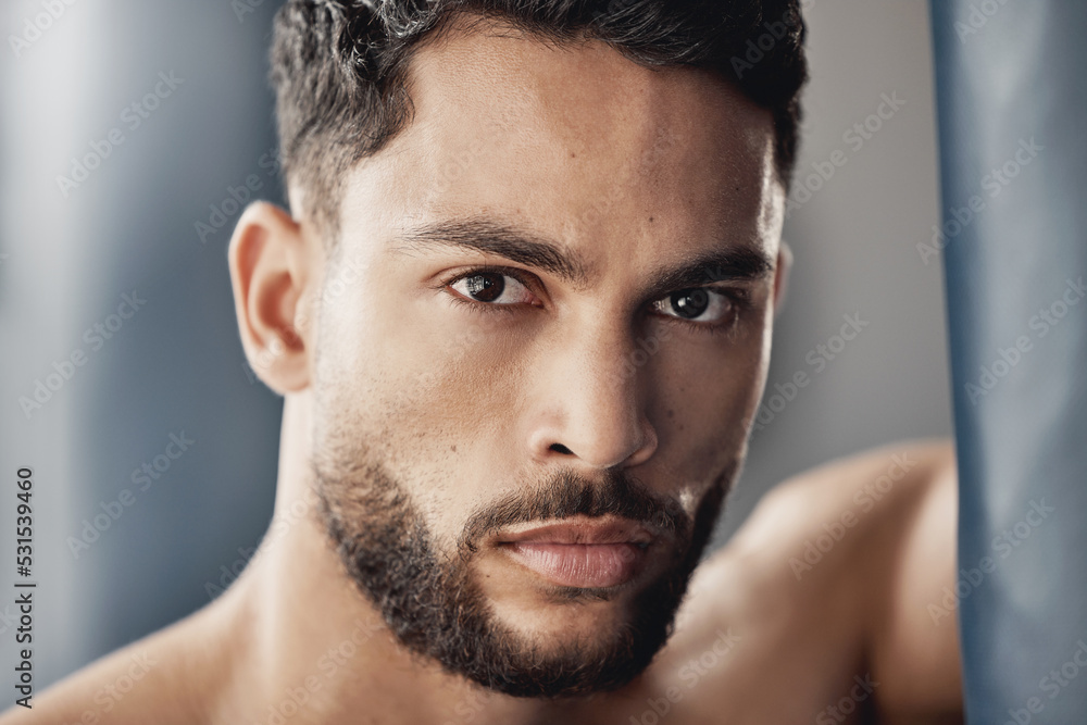 Fototapeta premium Portrait of muscular man in gym after fitness, exercise or workout and looking serious. Strong athlete cardio exercise, muscle power from sports and professional fight competition looking focused