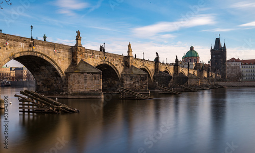 Side view of Charles Bridge in Prague on the banks of the Vltava River
