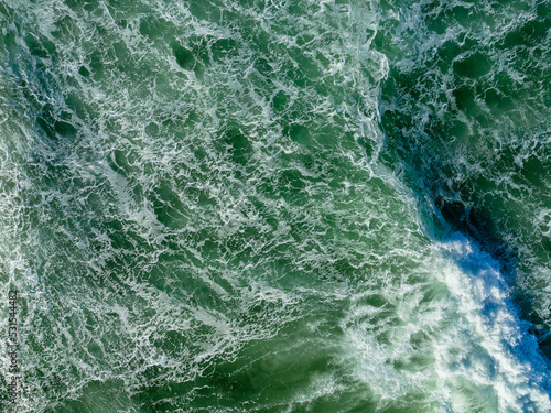 Aerial View Of A Set Of Waves Crashing Into A Beach On The Oregon Coast