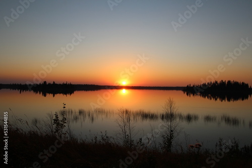 Fototapeta Naklejka Na Ścianę i Meble -  Setting Sun On The Lake, Elk Island National Park, Alberta