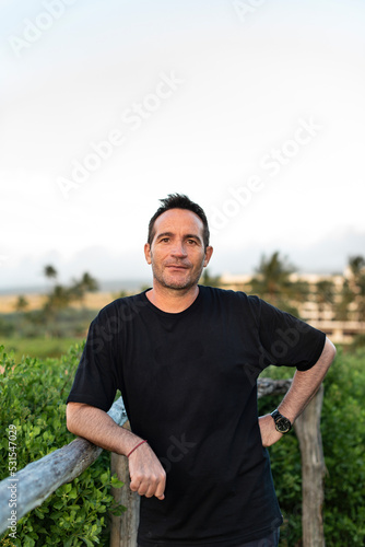 Portrair of handsome man looking at camera in Maui, Hawaii. Copy space.