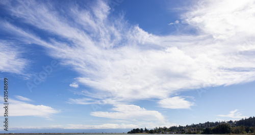 Cloudy Cloudscape during sunny summer Day on the West Coast of Pacific Ocean.