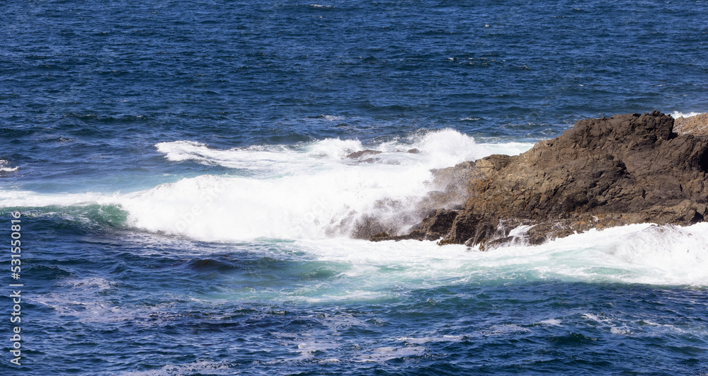 Rugged Rocks on a rocky shore on the West Coast of Pacific Ocean.