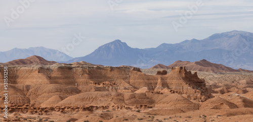 Red Rock Formations and Hoodoos in the Desert at Sunrise.