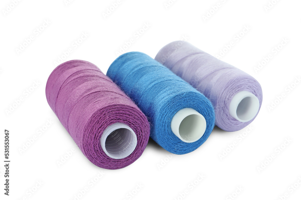 Different colorful sewing threads on white background Different colorful sewing threads on white background