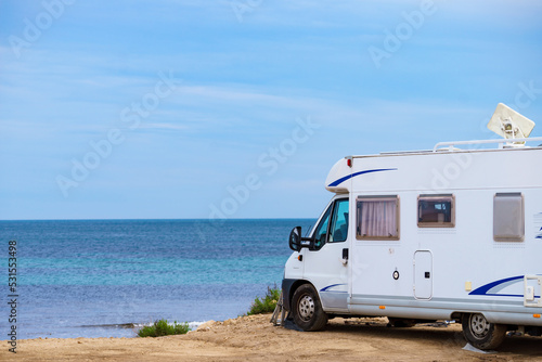 Camper on beach seashore. Holidays trip.