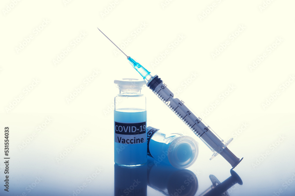 coronavirus vaccine with a syringe on a white background. the concept of mandatory vaccinations coronavirus vaccine with a syringe on a white background. the concept of mandatory vaccinations