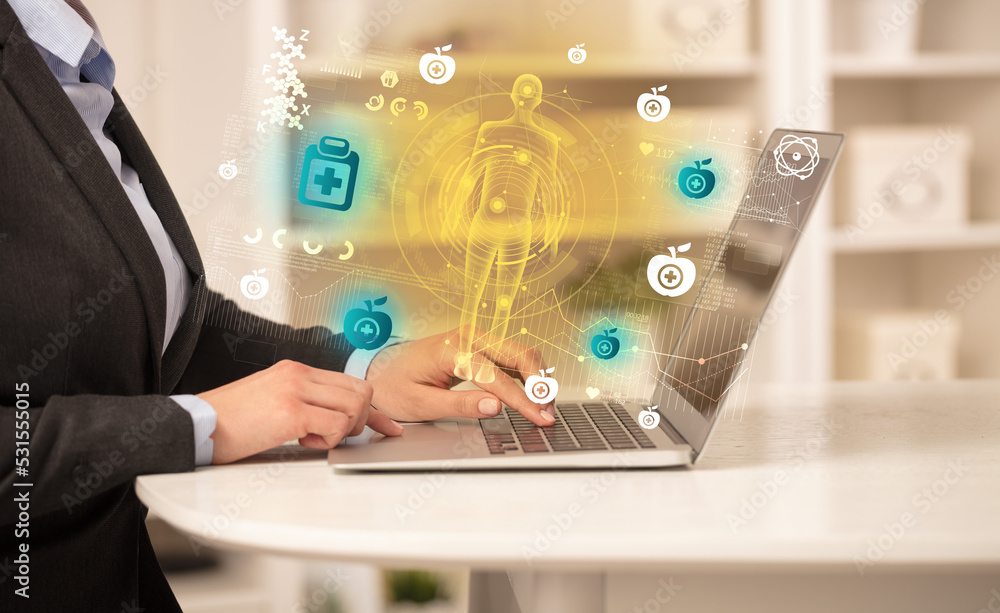 Doctor working on laptop with healthcare concept Doctor working on laptop with healthcare concept