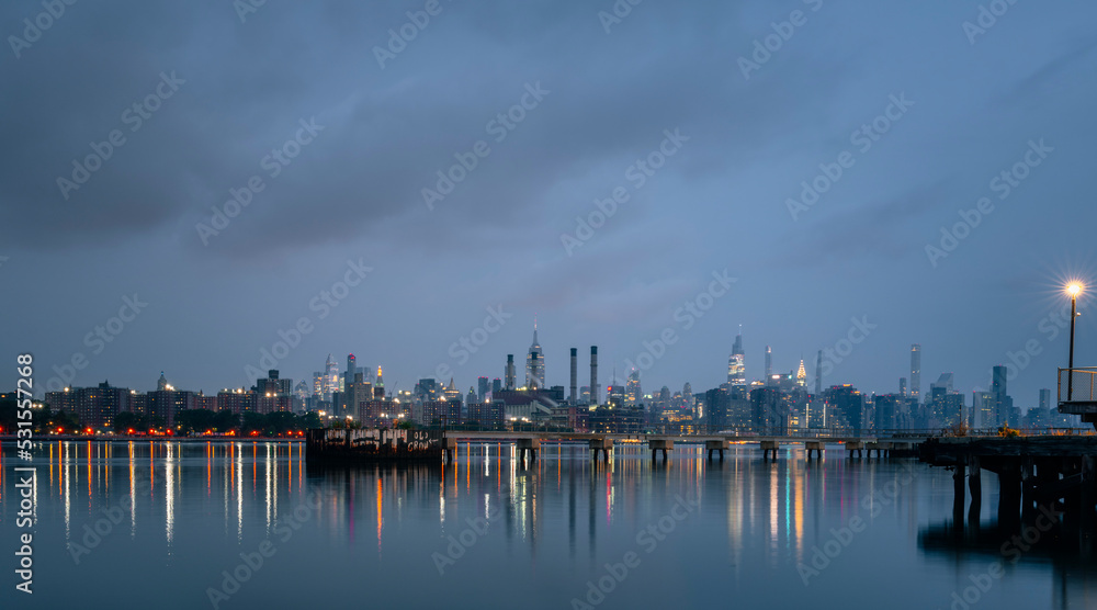 port at night panorama New York City manhattan river water reflections lights sky clouds could 