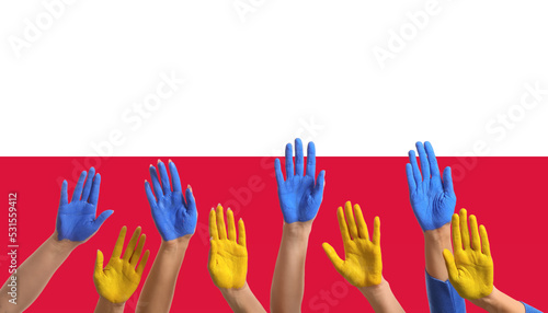 Many hands with painted palms in colors of Ukrainian flag against national flag of Poland