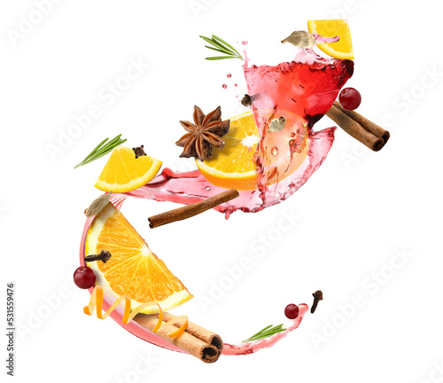 Splash of tasty mulled wine and ingredients on white background