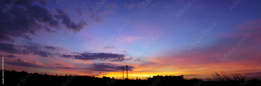 Panorama twilight sky and cloud background, Beautiful sunset sky above clouds with dramatic light Panorama twilight sky and cloud background, Beautiful sunset sky above clouds with dramatic light