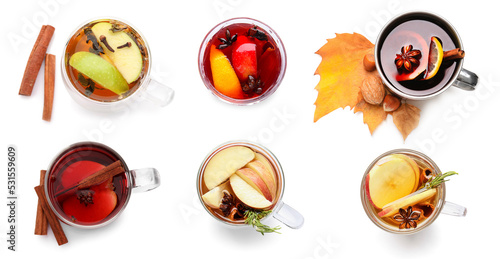Fotografie Set of delicious mulled wine isolated on white, top view