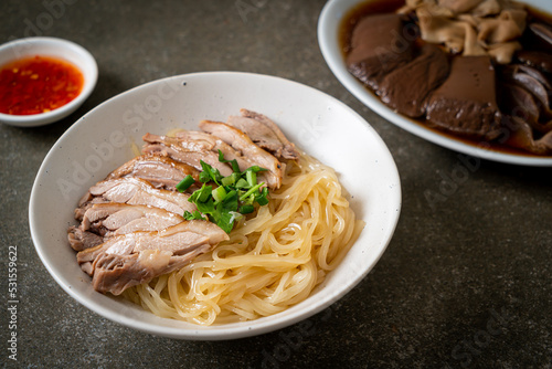 dried duck noodles in white bowl