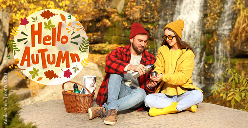 Couple in warm clothes havi...