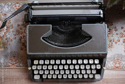 vintage typewriter on the wood table with copy space