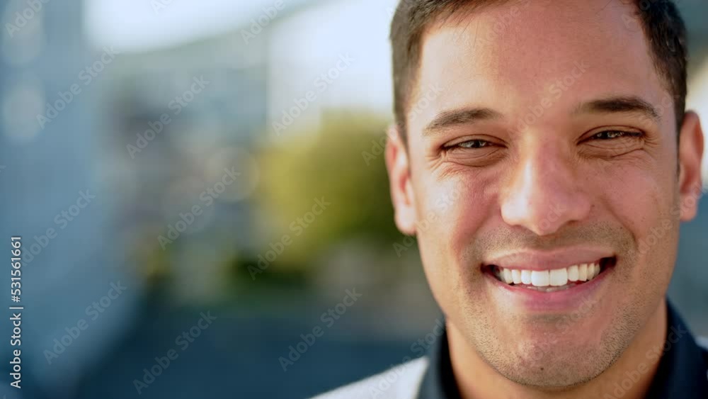 City, happy businessman and face with smile expression against a blurred urban background. Portrait of a young latino male manager or executive in corporate job smiling in success on a break outdoors City, happy businessman and face with smile expression against a blurred urban background. Portrait of a young latino male manager or executive in corporate job smiling in success on a break outdoors