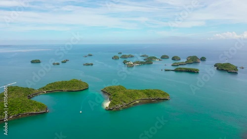 Aerial view of Small islands with beaches and lagoons in Hundred Islands National Park, Pangasinan, Philippines. Famous tourist attraction, Alaminos. photo