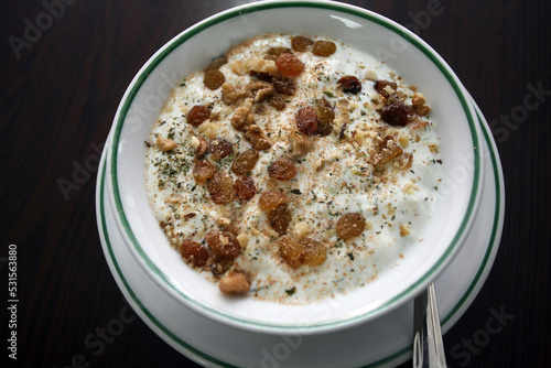 Traditional Turkish dessert 'Muhallebi' on the dessert plate. 