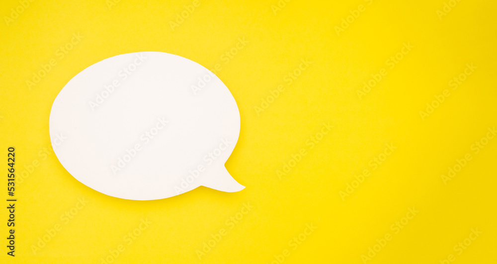 A blank white speech bubble over a light yellow background A blank white speech bubble over a light yellow background