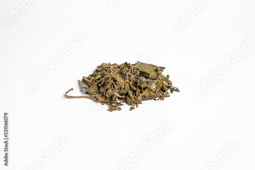 Chinese herbal medicine Tribulus terrestris or gohru on White background photo