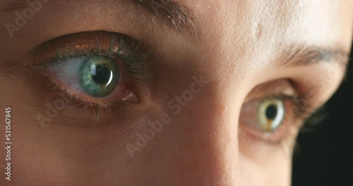 Vision, watching and eyes of a woman looking around, feeling paranoid and scared against a dark background, Mental health, fear and phobia by young female having panic attack, anxiety and terror
