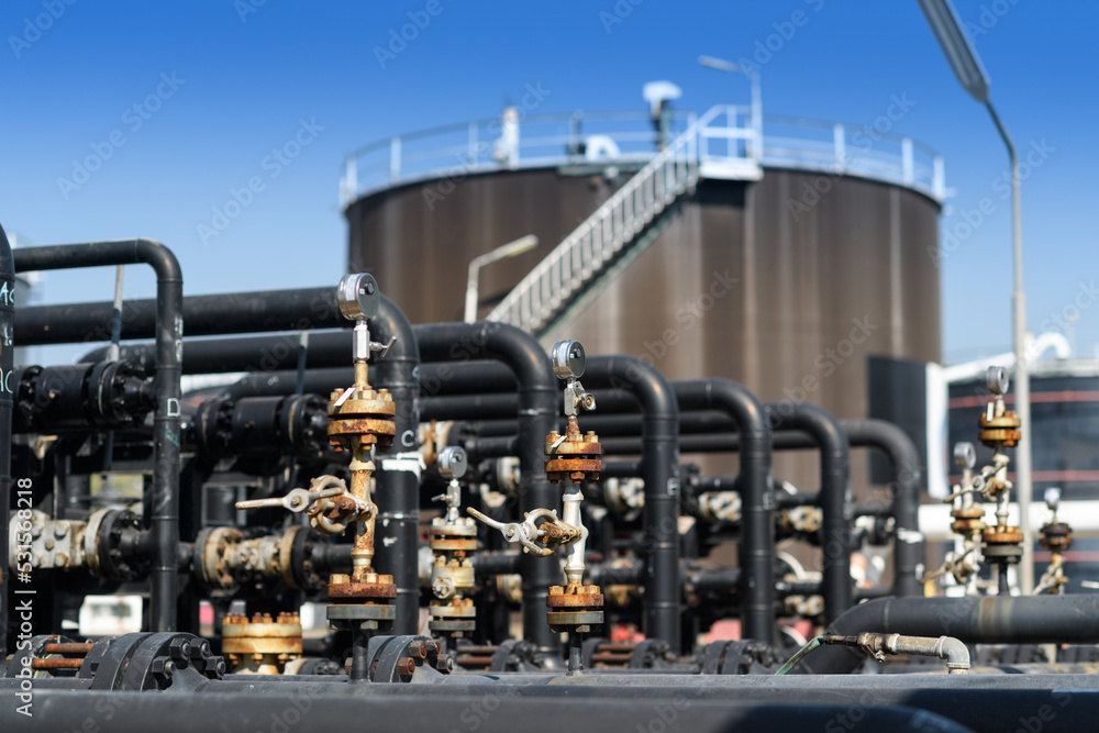 Industrial zone, Steel pipelines, valves, oil tank, cables and walkways