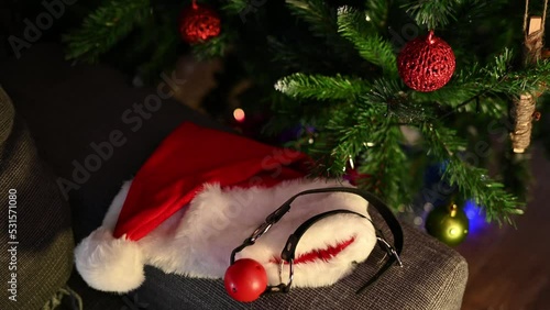 BDSM sex toys and santa hat on the christmas tree background photo