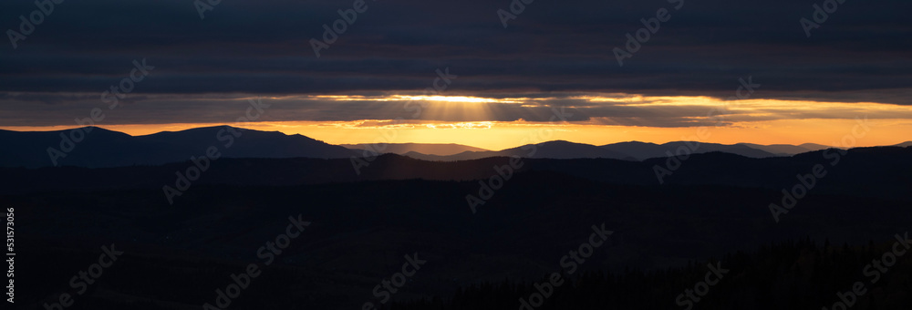 Banner of sunset in the mountains. Autumn landscape in the evening