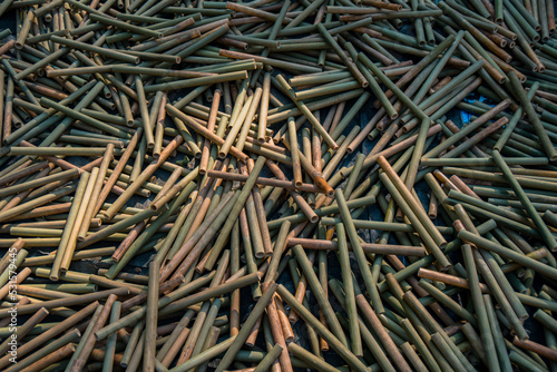 A pile of semi-finished bamboo pieces that will become a bamboo flute craft, the production process of this bamboo flute craft is done by hand by craftsmen