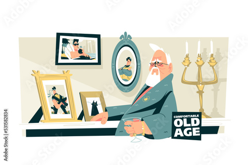 Elderly man sitting in chair and looking at photos