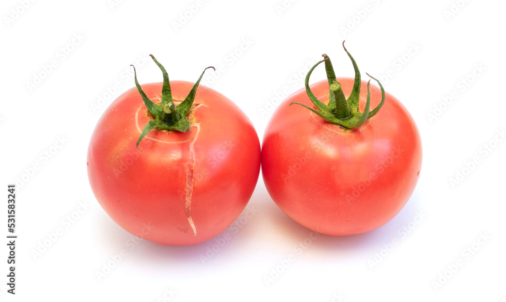Red ripe tomato with green branch isolated on white background. Red ripe tomato with green branch isolated on white background.