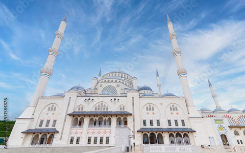 Low angle shot of Grand Camlia Mosque, or Buyuk Camlica Camii, a modern complex for Islamic worship, built in 2019, located in Camlica hill in Uskudar district, Istanbul, Turkey, in a summer day photo