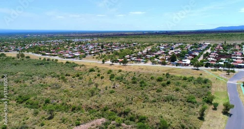 Drone shot of a town in a semi-desert plain in La Rioja Province, Northern Argentina photo