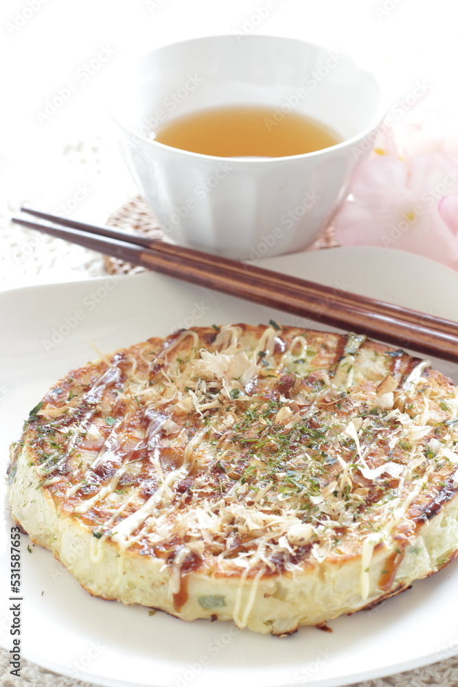 Japanese food, Okonomiyaki cabbage pancake with sauce and seaweed with mayonnaise Japanese food, Okonomiyaki cabbage pancake with sauce and seaweed with mayonnaise