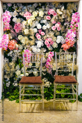 Fototapeta Naklejka Na Ścianę i Meble -  Interior design of a wedding chair with a floral background
