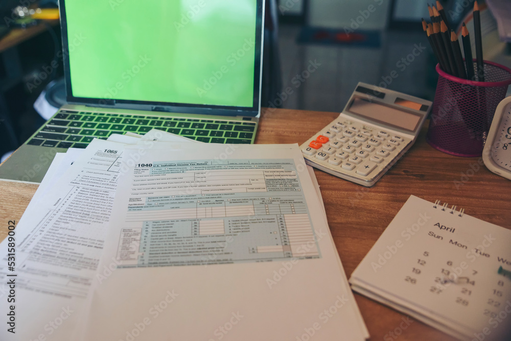 Naklejka premium Planning Budget and Tax Concept. Individual Income 1040 Tax Form For who have income According to United States law. This is the season that has to pay and deadline of tax payment.