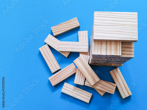 Top view wooden blocks tower games. Concept of business growth and risk.