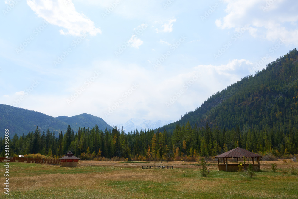Gazebo on the background of the autumn forest and mountains. Picturesque place to relax. Gazebo on the background of the autumn forest and mountains. Picturesque place to relax.