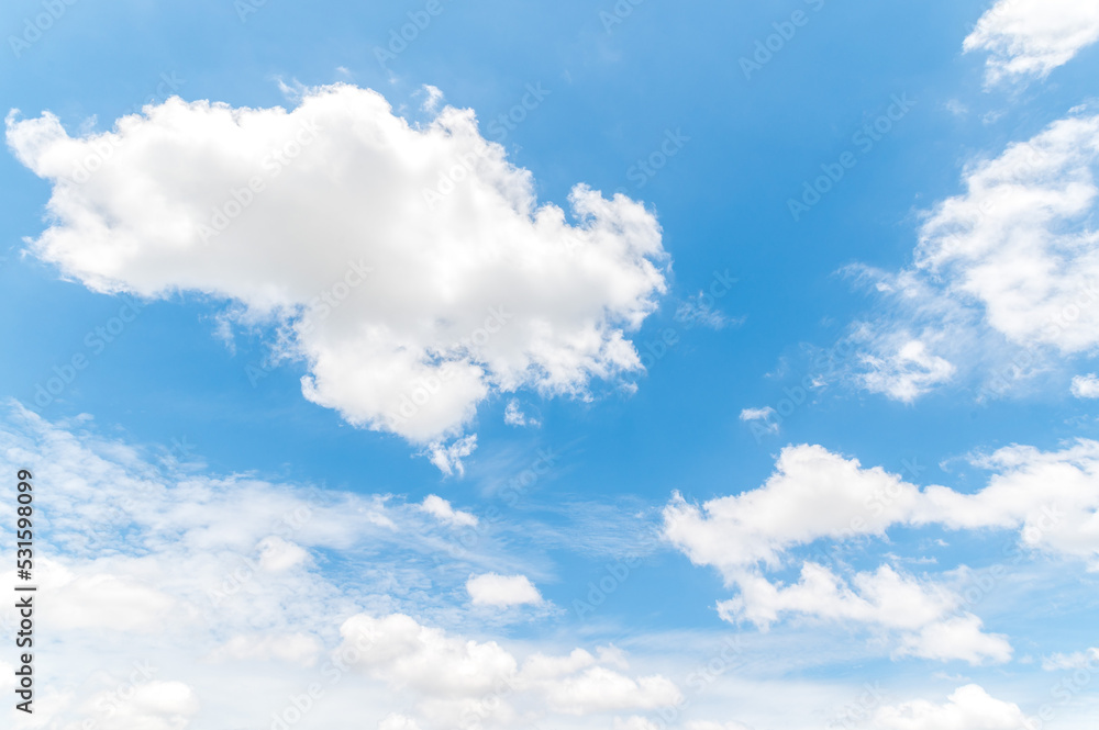 Beautiful white fluffy clouds in blue sky. Nature background from white clouds in sunny day Beautiful white fluffy clouds in blue sky. Nature background from white clouds in sunny day