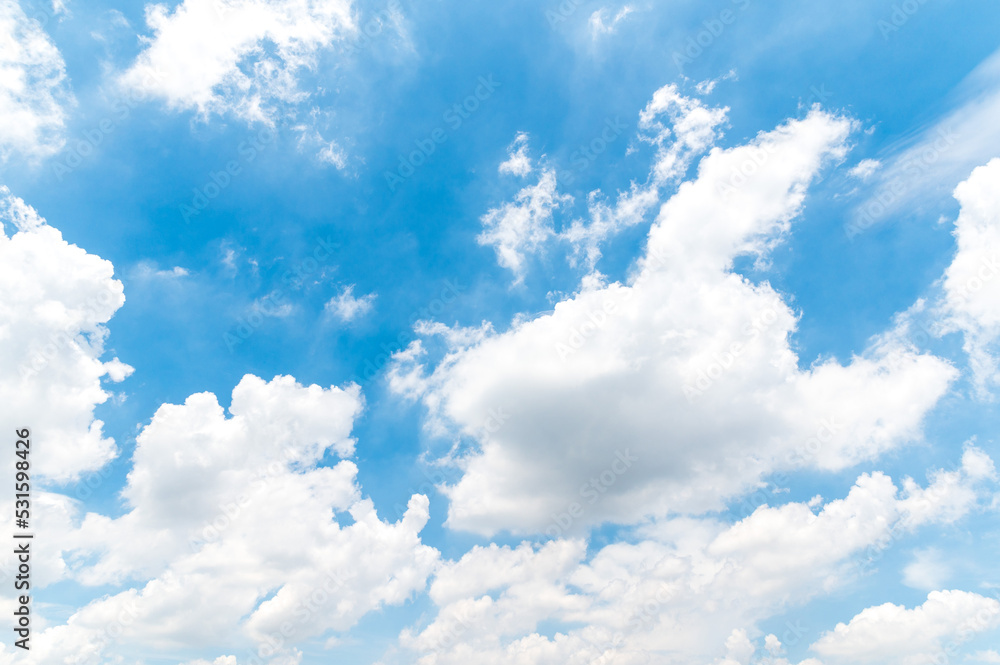Beautiful white fluffy clouds in blue sky. Nature background from white clouds in sunny day