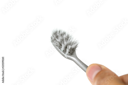 Toothbrush expired. Old toothbrush on man hand should be a new one. concept for Good oral health.