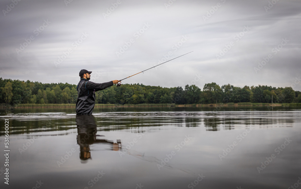 Fall Fishing background. Fisherman catching on a wild river. Fall Fishing background. Fisherman catching on a wild river.