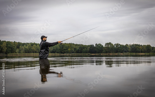 Fall Fishing background. Fisherman catching on a wild river. 