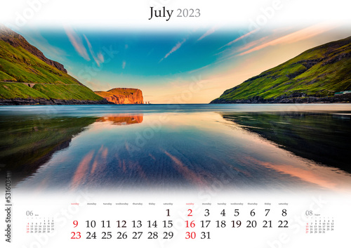 Wall calendar for 2023 year. July, B3 size. Set of calendars with amazing landscapes. Calm waters of Tjornuvik beach. Fantastic sunset on Faroe Islands, Denmark. Monthly calendar ready for print.. photo