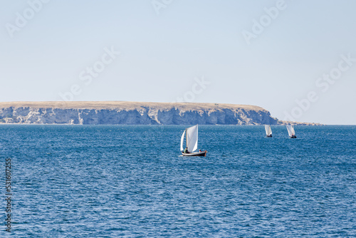 sailing boats at sea with island Big Karlsö in the background