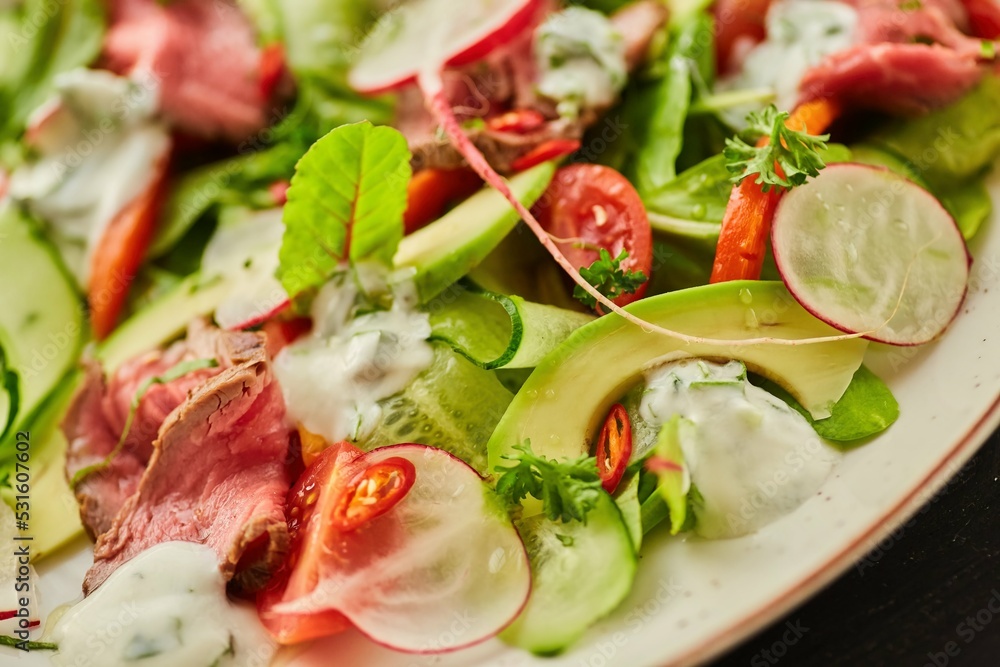 Salad of meat, vegetables and herbs. Food from the chef in a restaurant or cafe. Salad of meat, vegetables and herbs. Food from the chef in a restaurant or cafe.