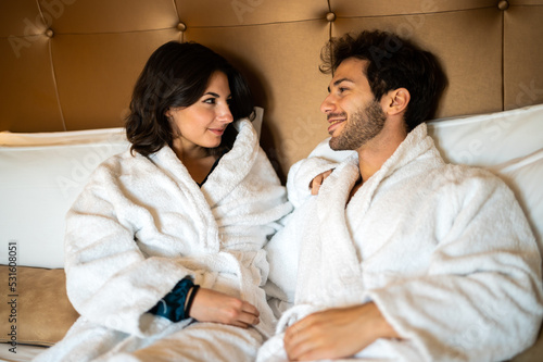 Romantic couple enjoying honeymoon and wellness treatments in a hotel suite