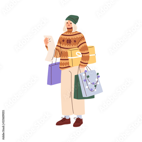 Woman checking Christmas shopping list, preparing for winter holiday. Happy g...