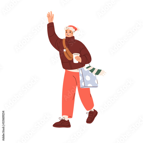 Happy man walking with Christmas shopping bag, takeaway coffee cup. Person ge...